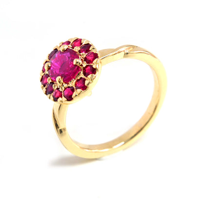 Unique ruby ring featuring a halo design, adding a touch of luxury to any outfit.