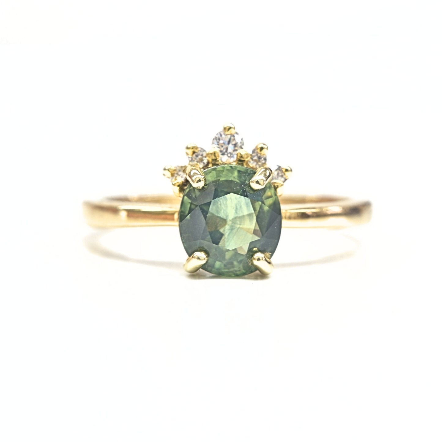 Discover the Chiang Mai Blossom ring, featuring a Thai green sapphire, natural diamonds, and 14K yellow gold. Handcrafted with love in Thailand.