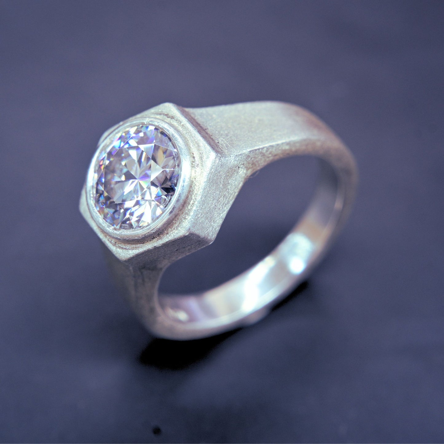 HexaNova handmade moissanite ring in 925 sterling silver with hexagonal bezel setting and brushed matte finish
