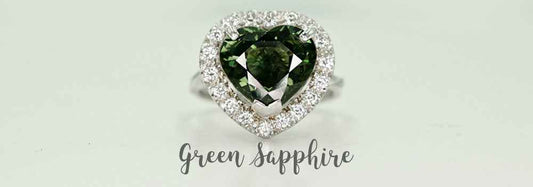 Handmade engagement ring with green sapphire and diamond halo
