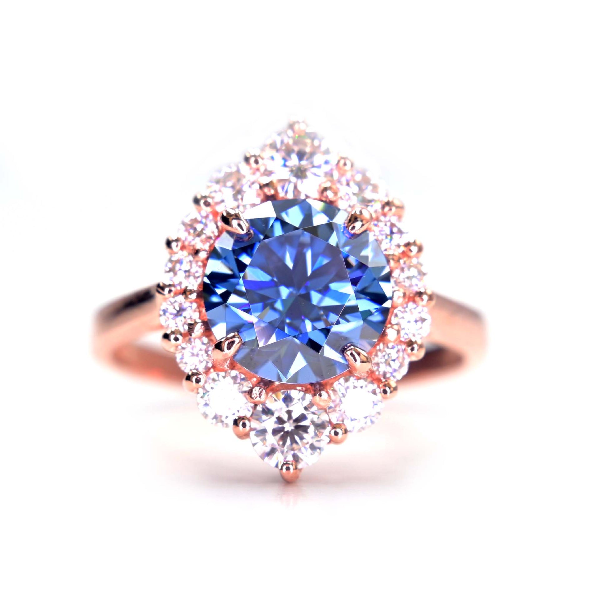 Stunning blue moissanite ring in rose gold