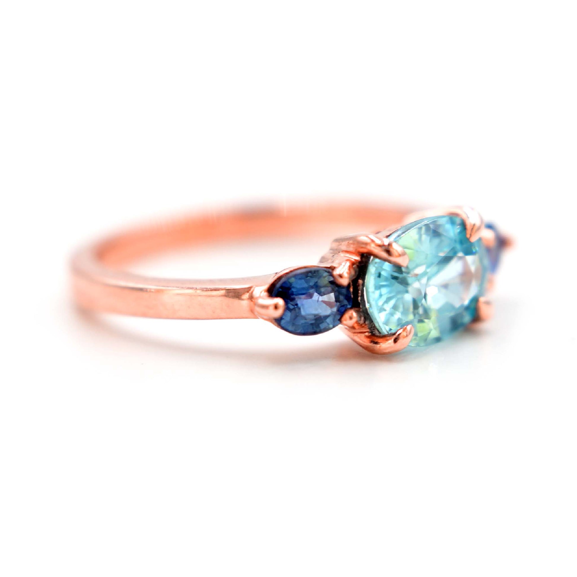 Engagement ring with blue zircon and blue sapphires