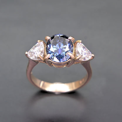 Oval Blue Moissanite Ring in 14K Gold Three-Stone Design