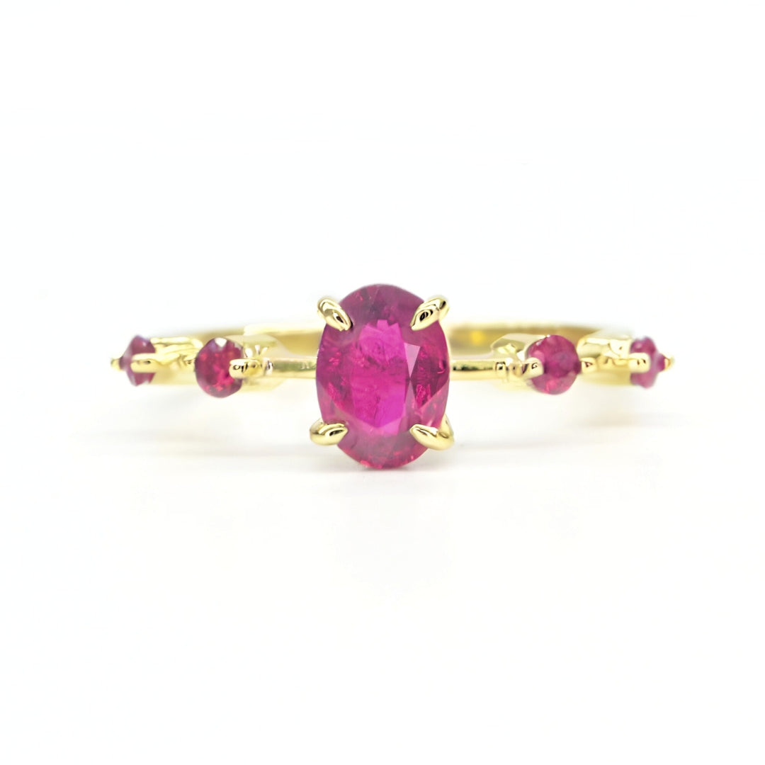 Promise ring with natural ruby center and accent stones in gold