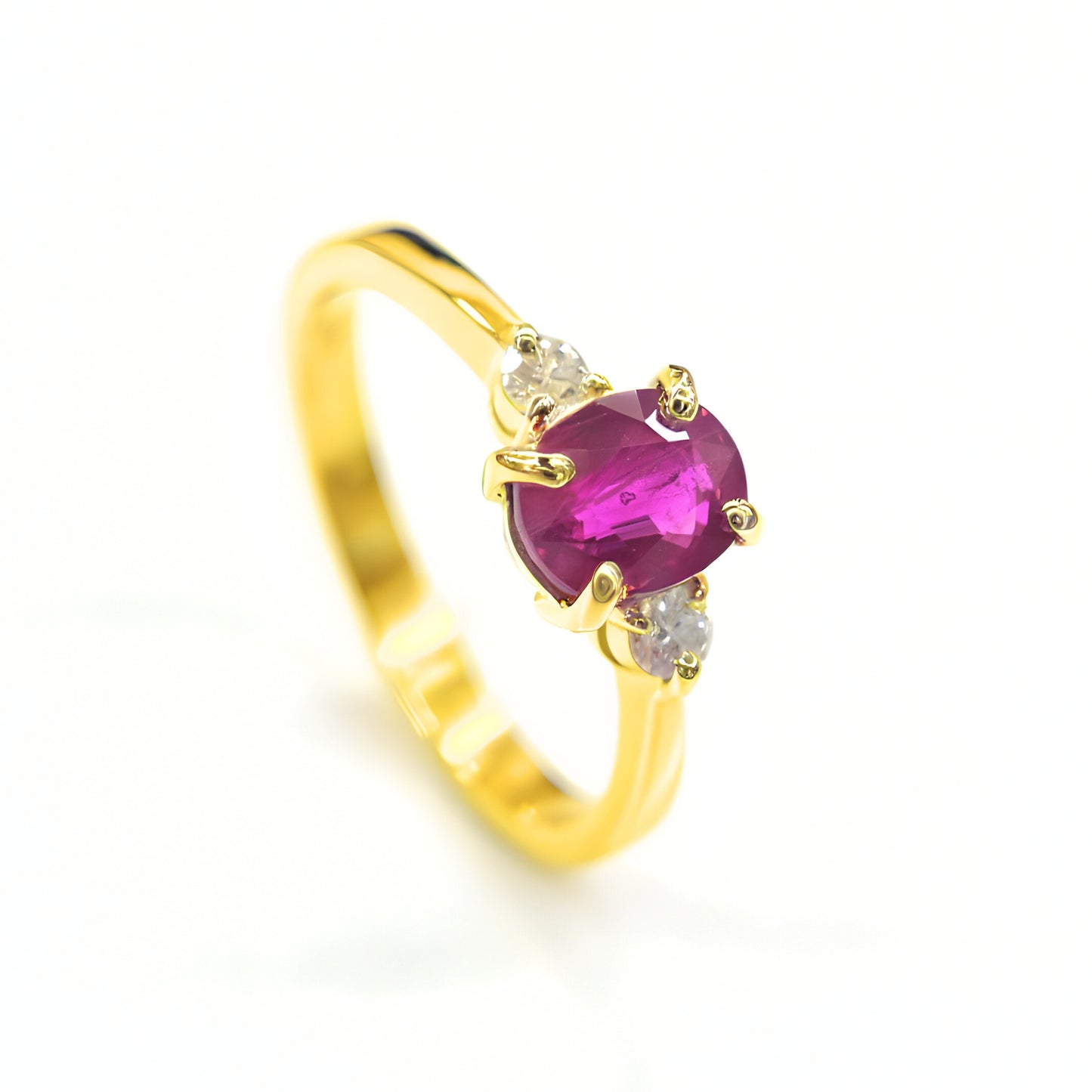 Luxury ruby ring with twin diamonds set in 18K yellow gold