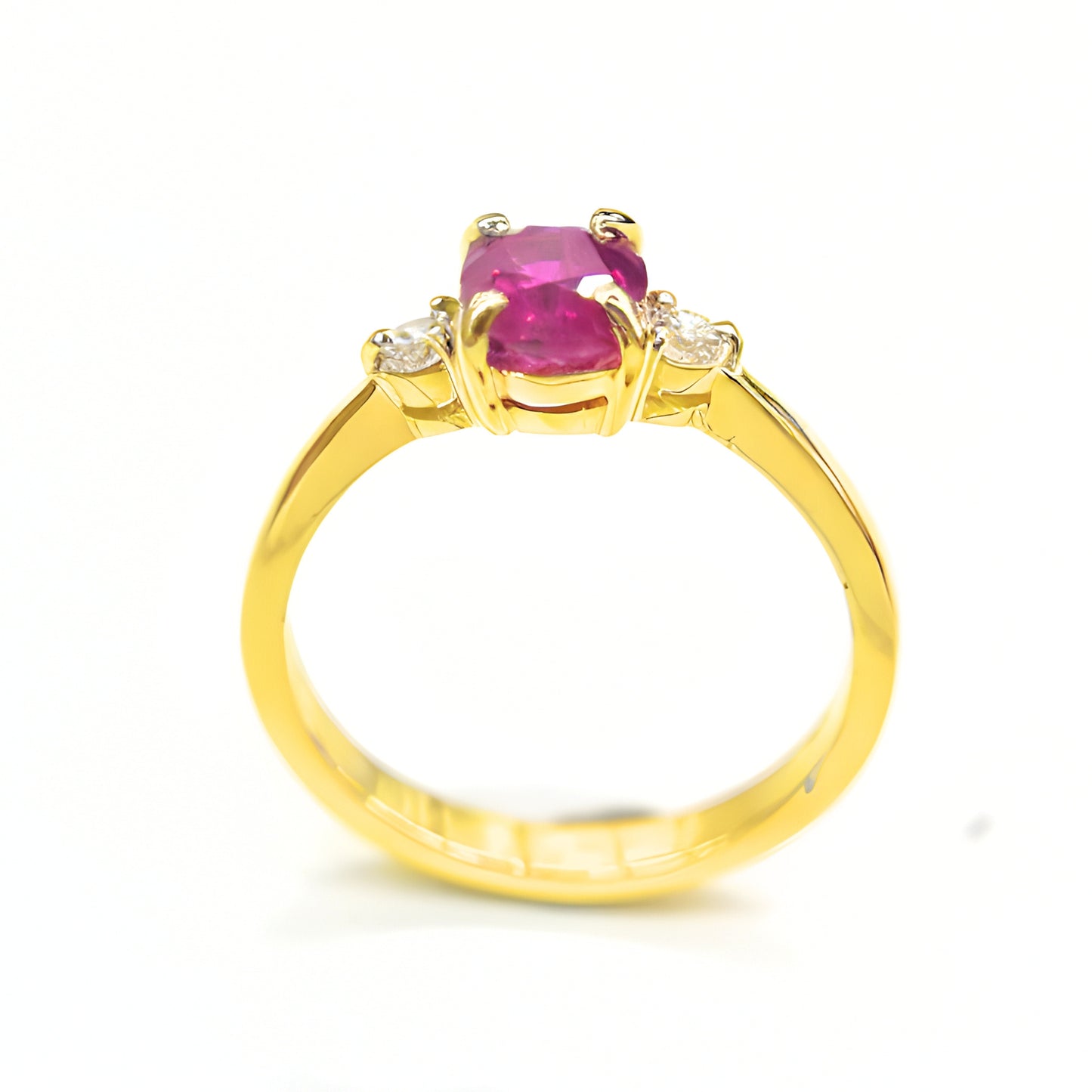 Minimalist ruby and diamond ring in polished yellow gold band