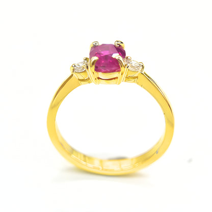 Minimalist ruby and diamond ring in polished yellow gold band