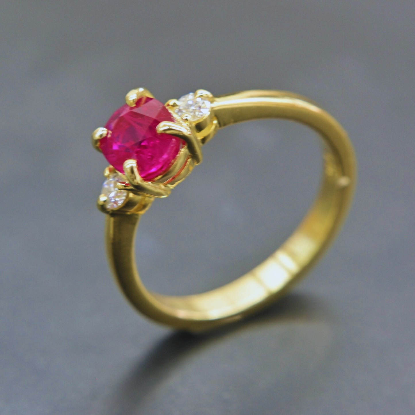 Fine ruby and diamond ring handcrafted in 18K yellow gold