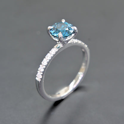 Elegant white gold blue zircon engagement style ring