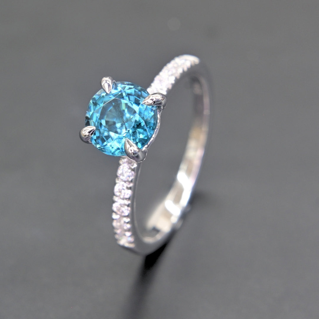 High polish white gold blue zircon ring side view