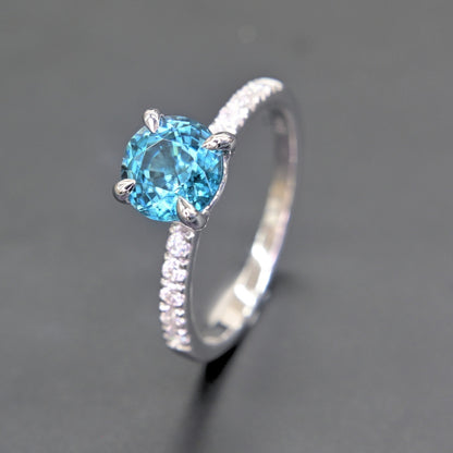 High polish white gold blue zircon ring side view
