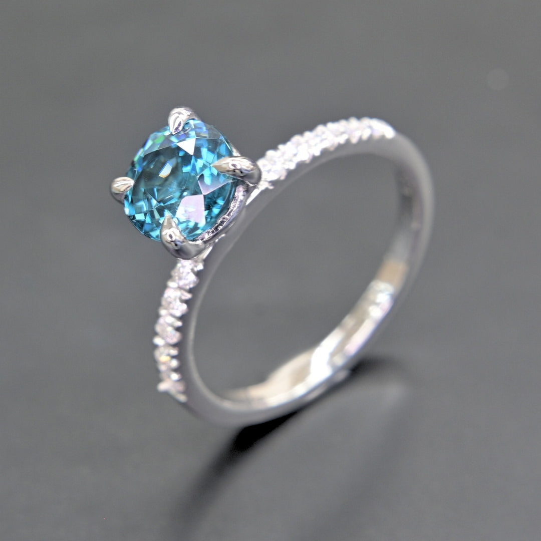18K white gold gemstone ring with blue zircon centerpiece