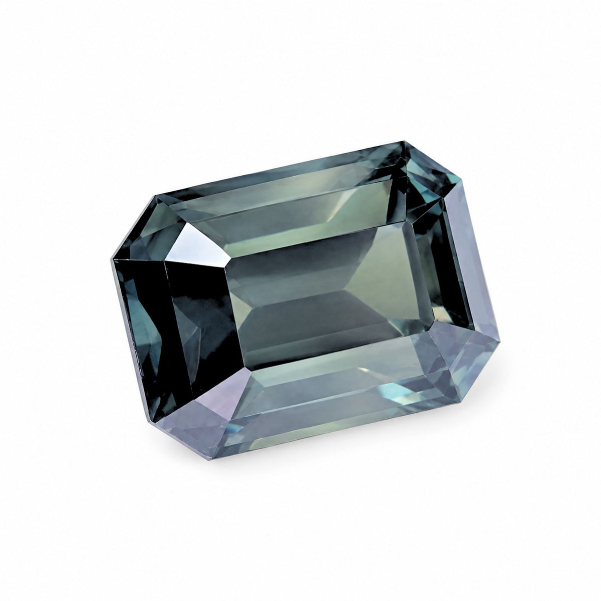 Top down studio view of rectangular step cut unheated green sapphire