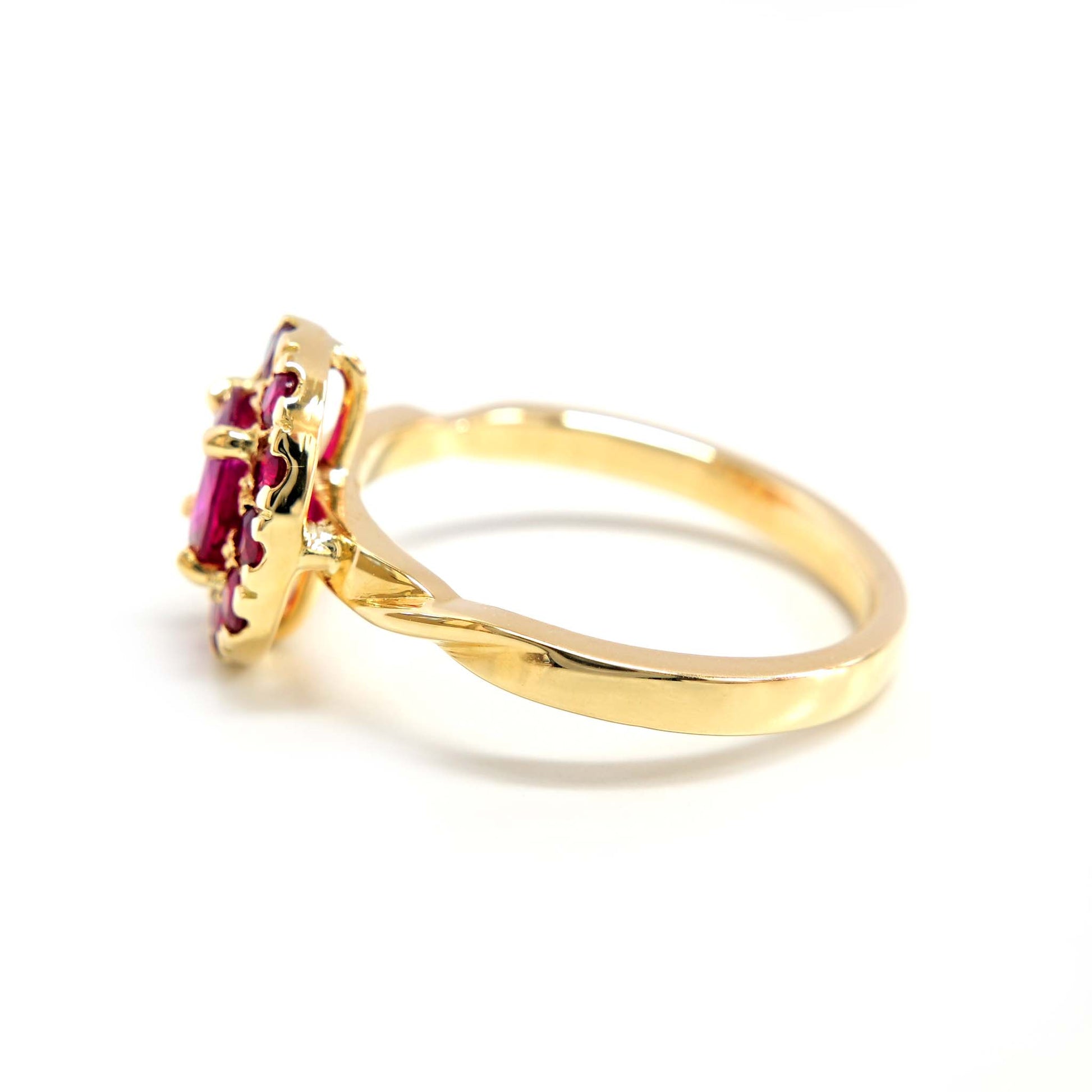 Dazzling ruby ring surrounded by a sparkling halo of rubies.