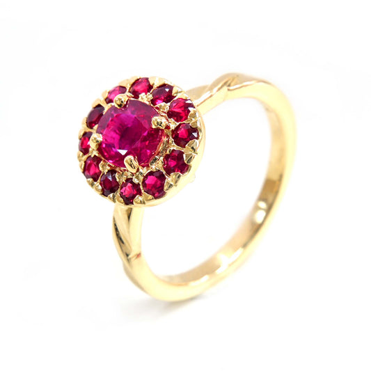 Elegant ruby gemstone set in a halo design, crafted in yellow gold