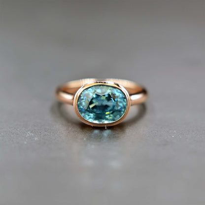 Front view of Natural blue zircon in 14k romantic rose gold
