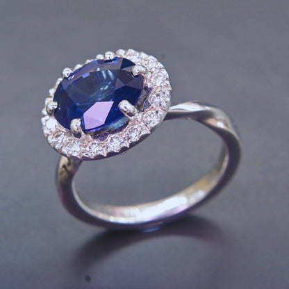 Luxury sapphire halo ring crafted with natural diamonds in 18K gold