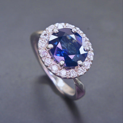 Elegant handmade sapphire and diamond engagement ring in white gold