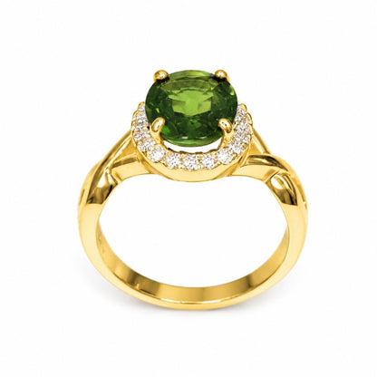 Natural green sapphire halo ring crafted in 14K yellow gold with round brilliant diamonds, handcrafted fine jewelry perfect for anniversaries and special occasions.