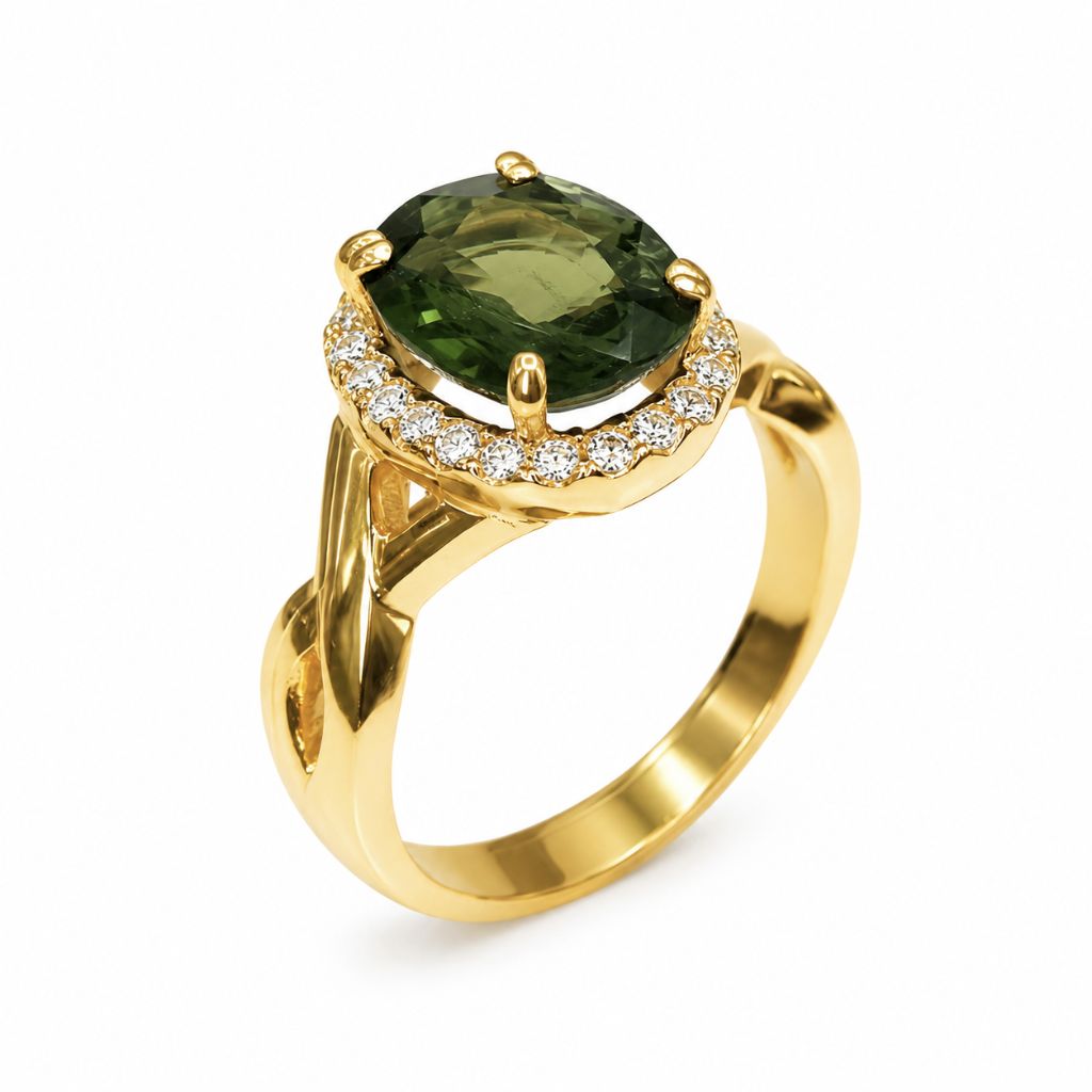 Luxury 14K yellow gold green sapphire ring with an oval faceted gemstone surrounded by a diamond halo, timeless designer gemstone jewelry.