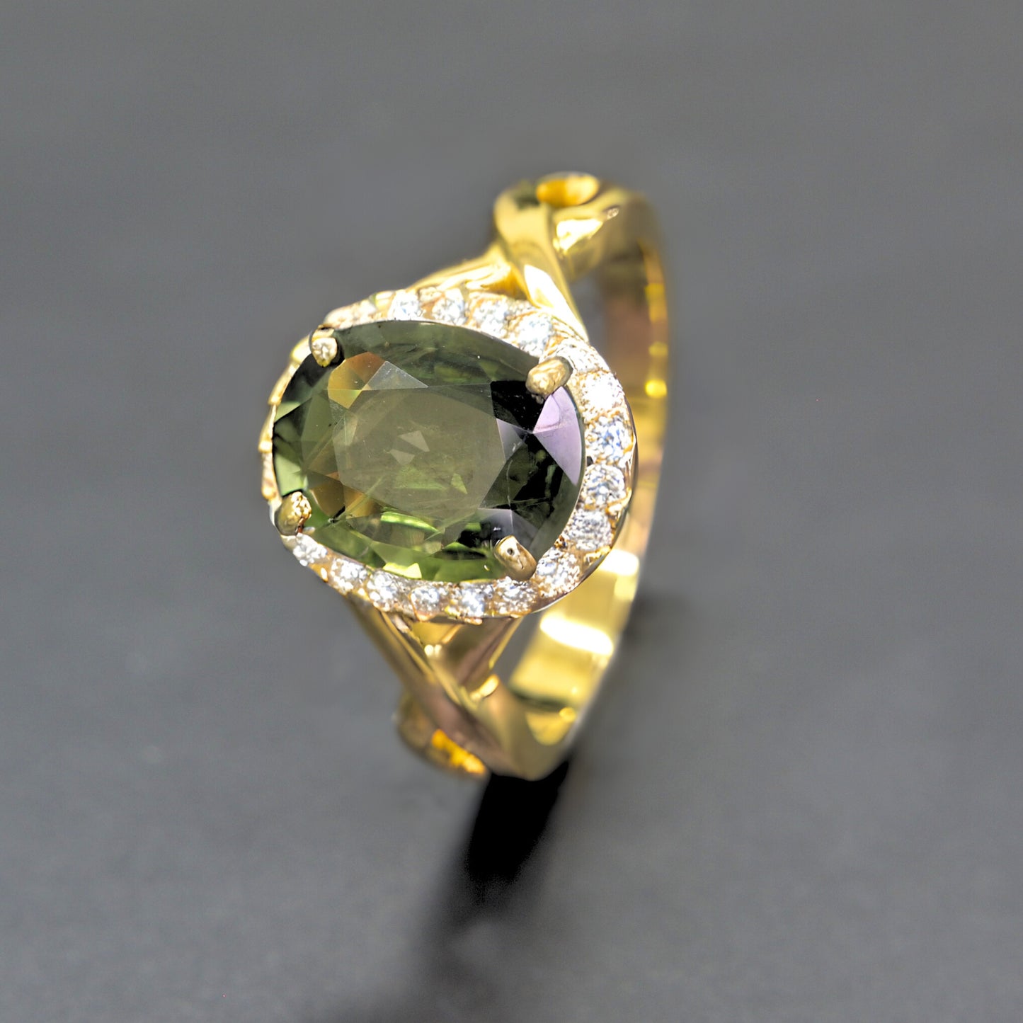 Handmade green sapphire halo diamond ring in 14K yellow gold by Shiraz Jewelry