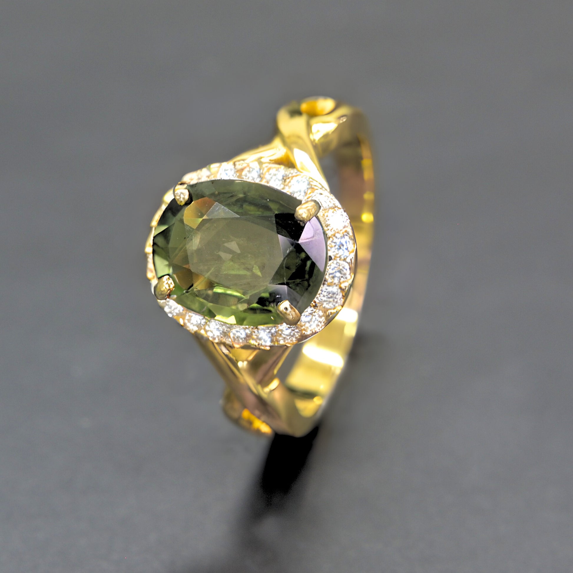 Handmade green sapphire halo diamond ring in 14K yellow gold by Shiraz Jewelry