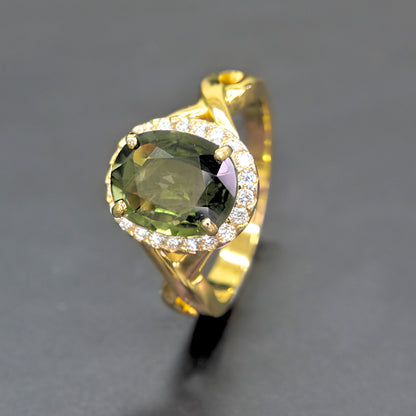 Handmade green sapphire halo diamond ring in 14K yellow gold by Shiraz Jewelry