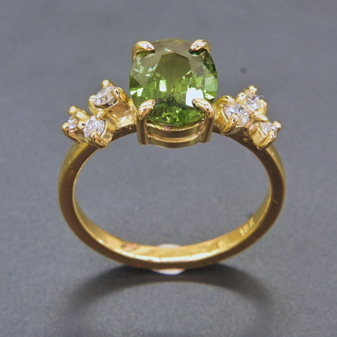 Elegant sapphire and diamond statement ring in classic yellow gold setting