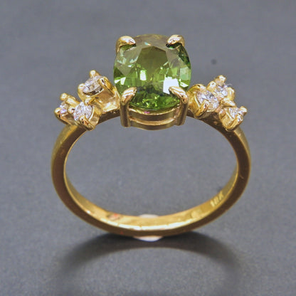 Elegant sapphire and diamond statement ring in classic yellow gold setting