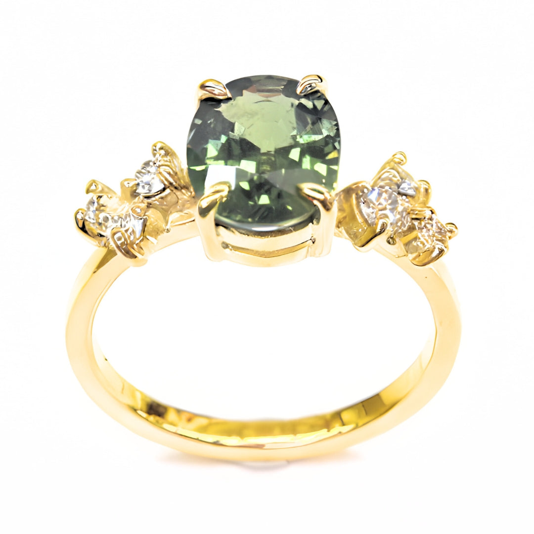 Sapphire engagement ring with green sapphire center and diamond details