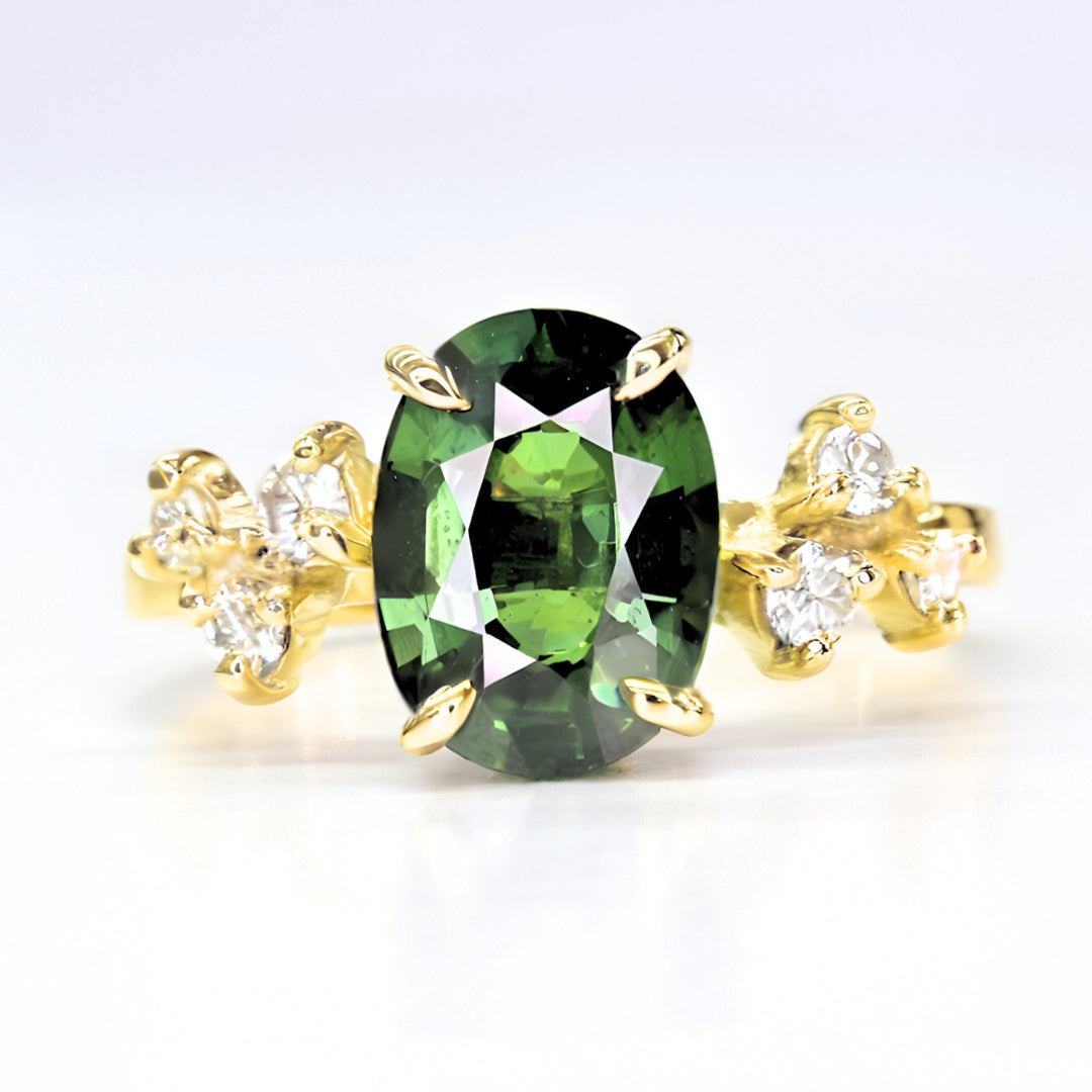 Handcrafted sapphire and diamond gemstone ring in polished yellow gold