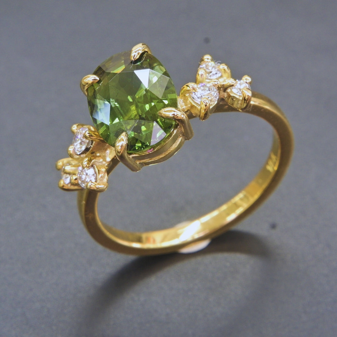 Natural green sapphire cocktail ring with brilliant cut diamonds in 18K gold