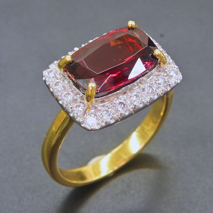 Bold Rhodolite Garnet ring with double halo of Moissanite accents