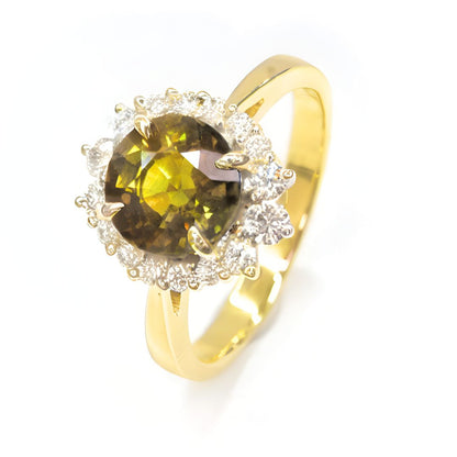 Green-yellow sapphire and diamond halo ring in 14K yellow gold