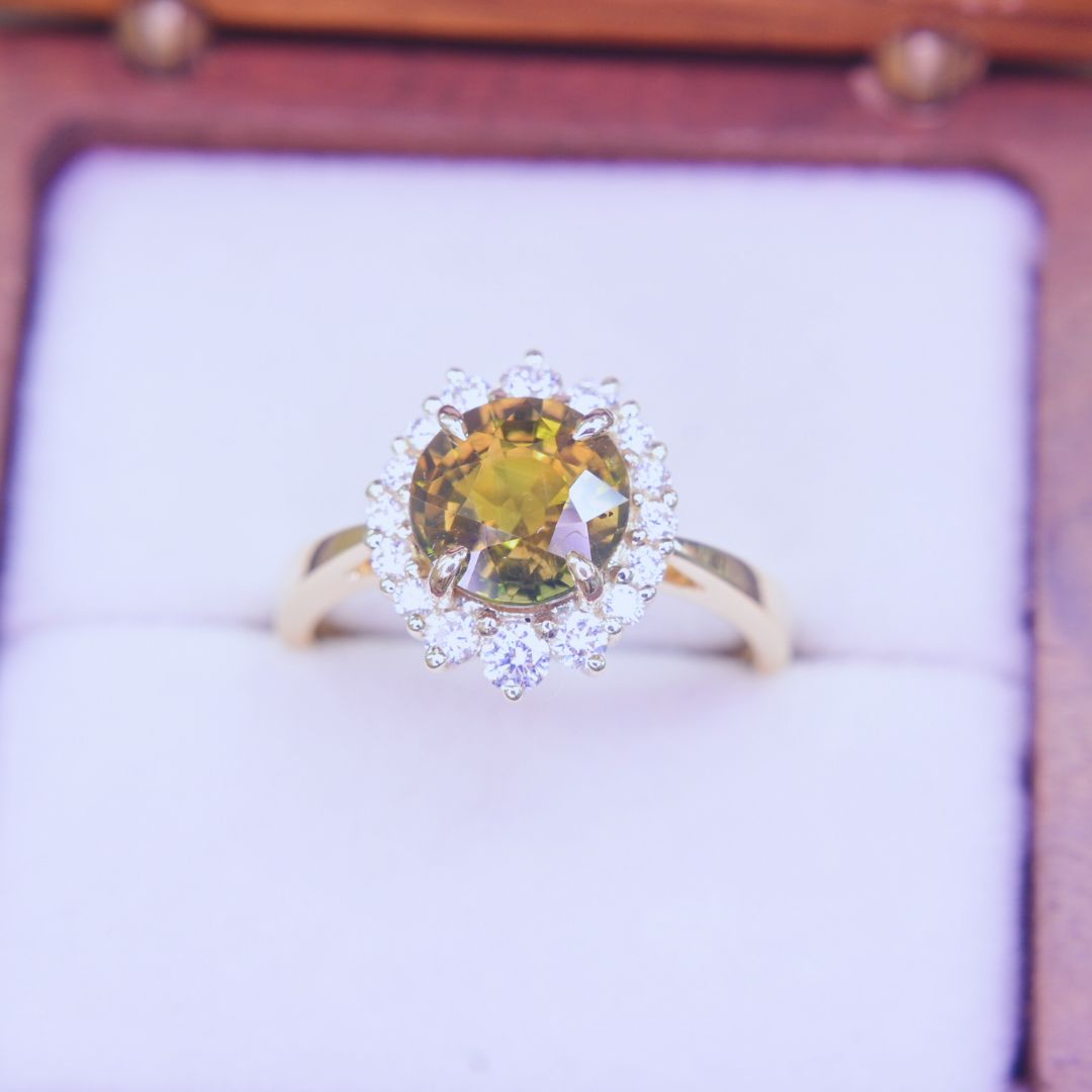 Lustrous sapphire engagement ring with natural diamond accents