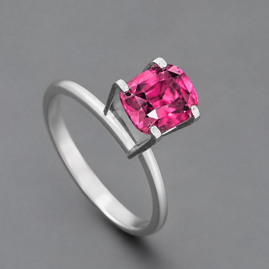 Certified 2.12 carat cushion cut Mozambique ruby on gem holder