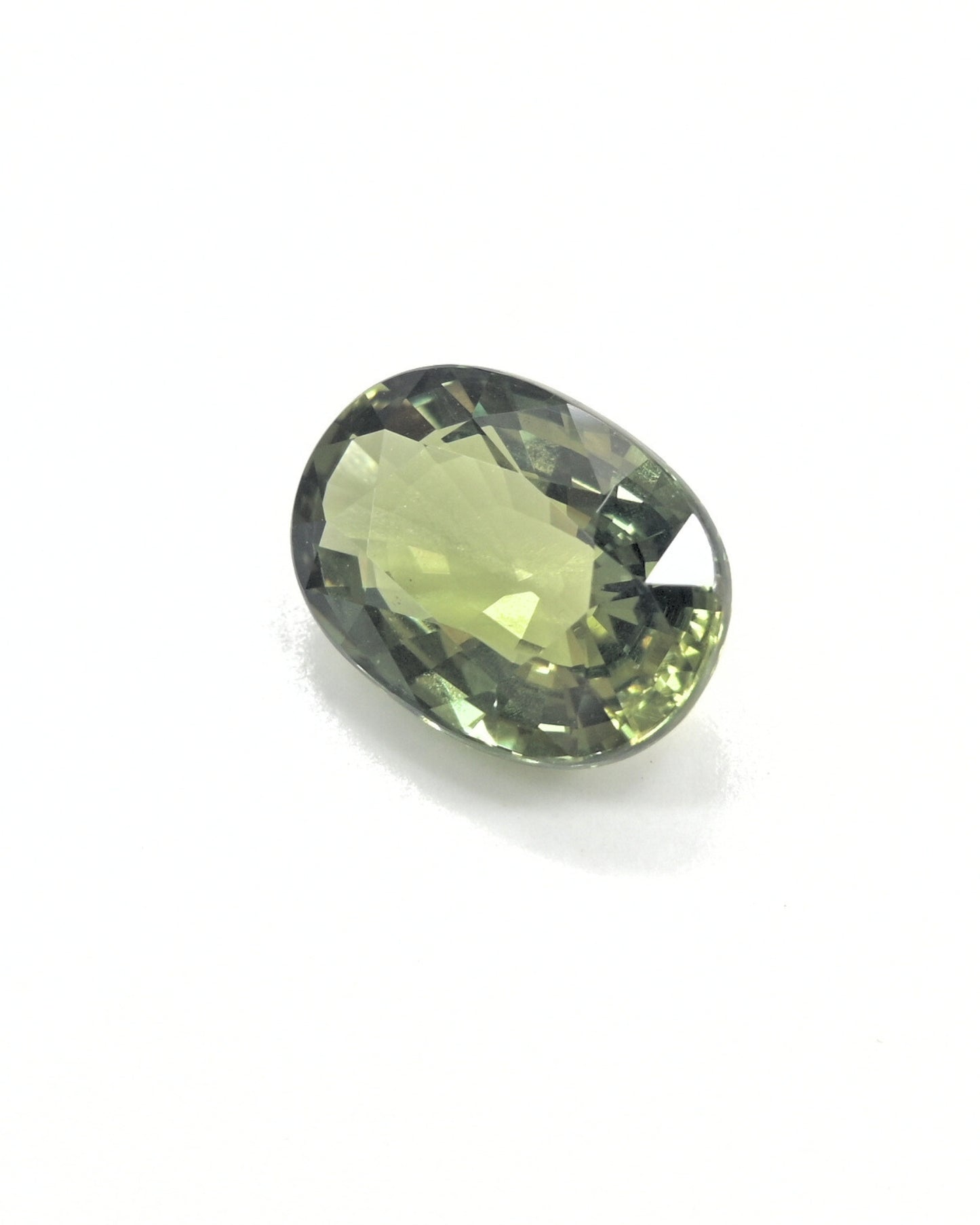 Shiraz Jewelry's 3.32ct unheated natural olive green sapphire gemstone.