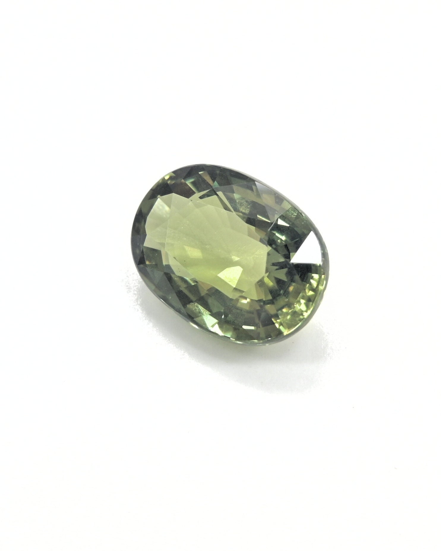 Shiraz Jewelry's 3.32ct unheated natural olive green sapphire gemstone.