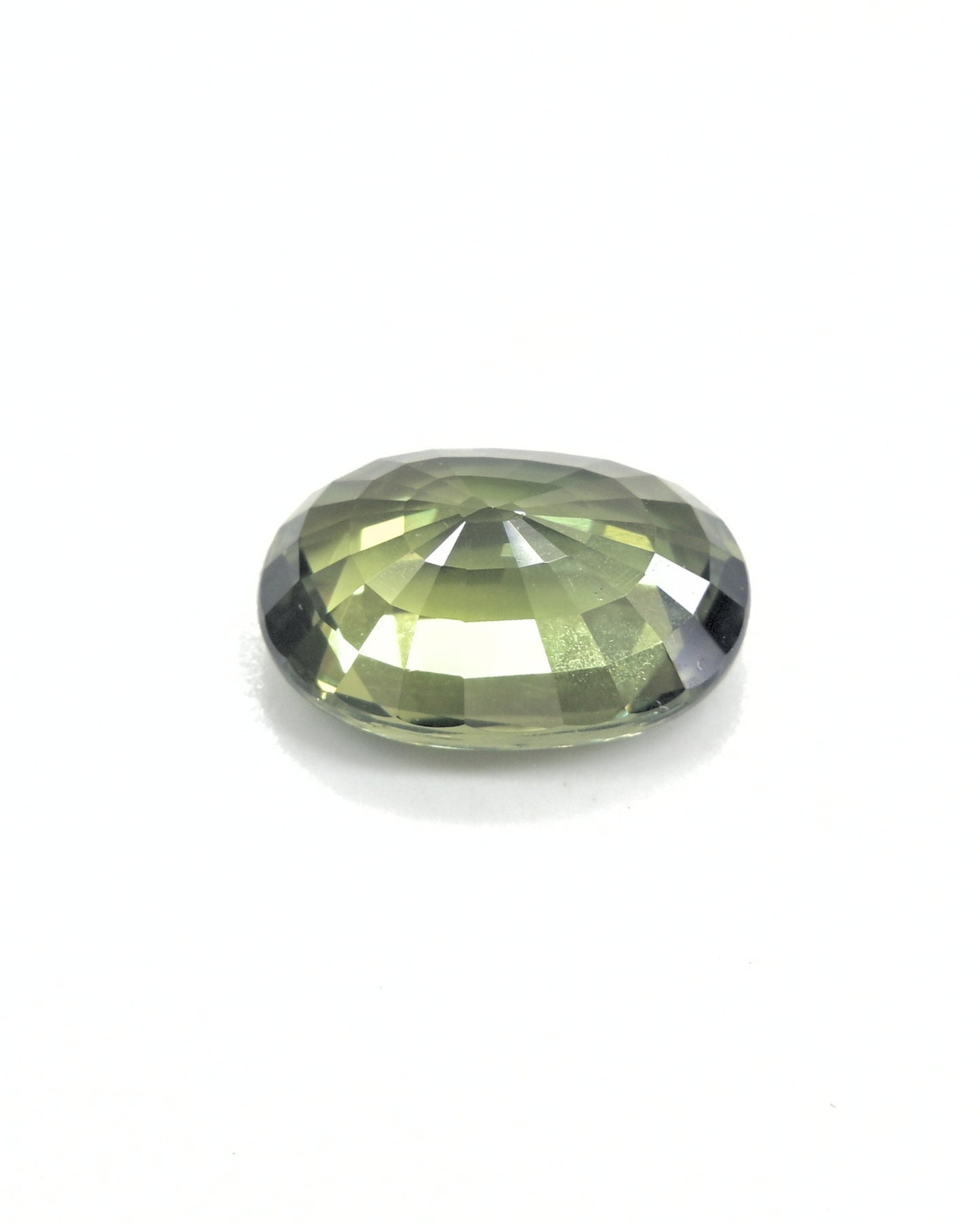 Close-up of a deep olive green sapphire, 3.32 carats, with natural color.