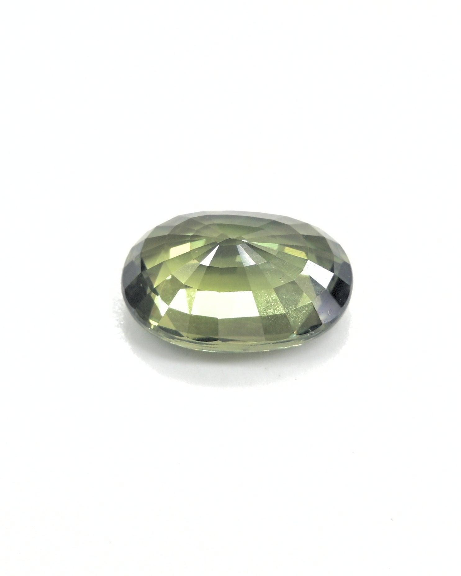 Close-up of a deep olive green sapphire, 3.32 carats, with natural color.