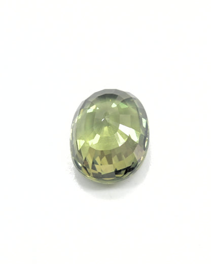 Loose 3.32ct oval cut natural green sapphire, perfect for custom jewelry.