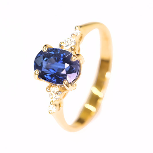 Oval blue sapphire engagement ring with natural diamonds in 14K yellow gold