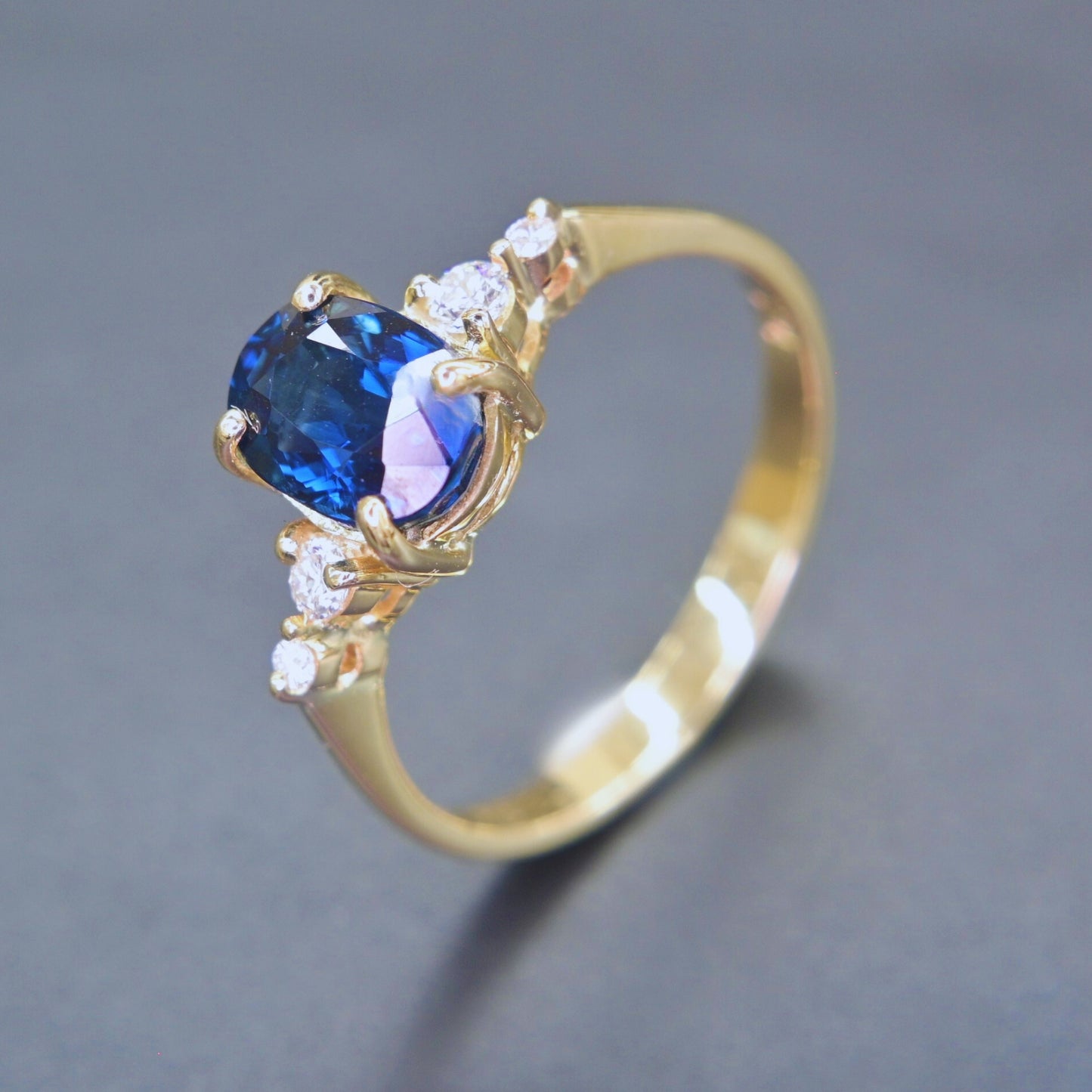 Handcrafted blue sapphire and diamond ring in 14K yellow gold