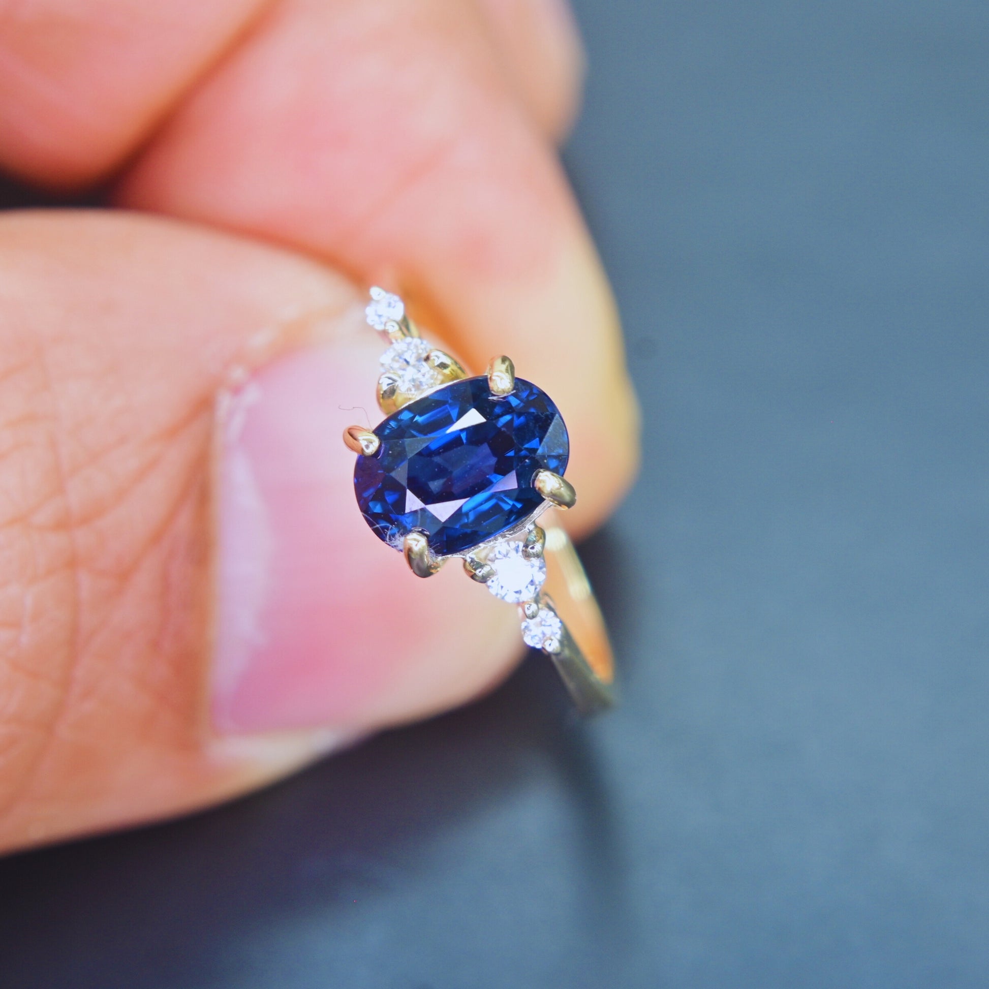 Natural blue sapphire engagement ring with side diamonds