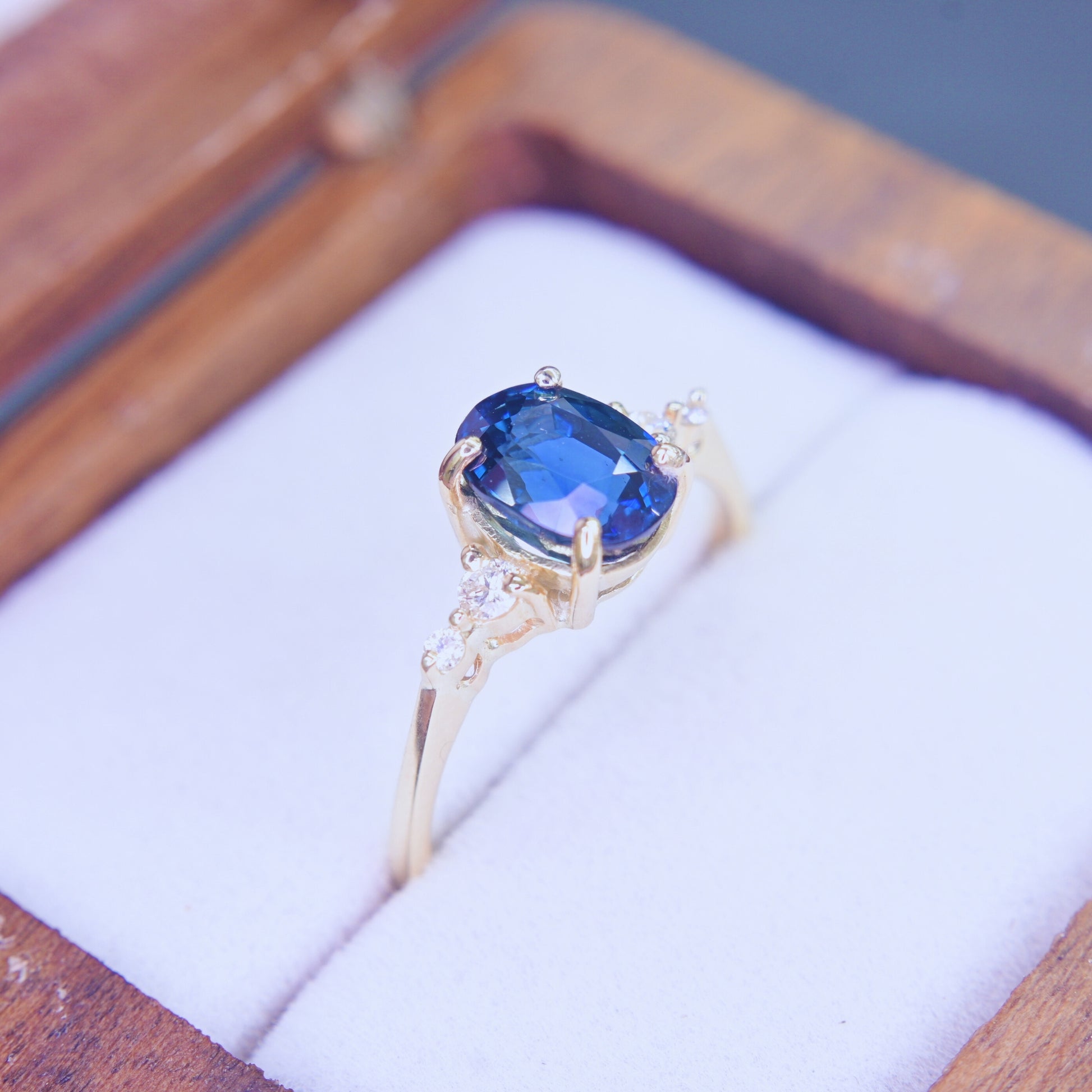 Classic oval blue sapphire diamond ring in 14K yellow gold