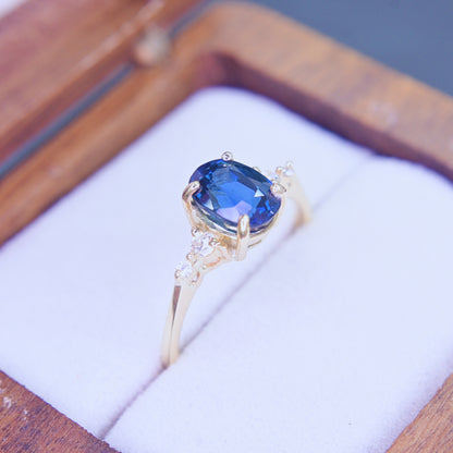 Classic oval blue sapphire diamond ring in 14K yellow gold
