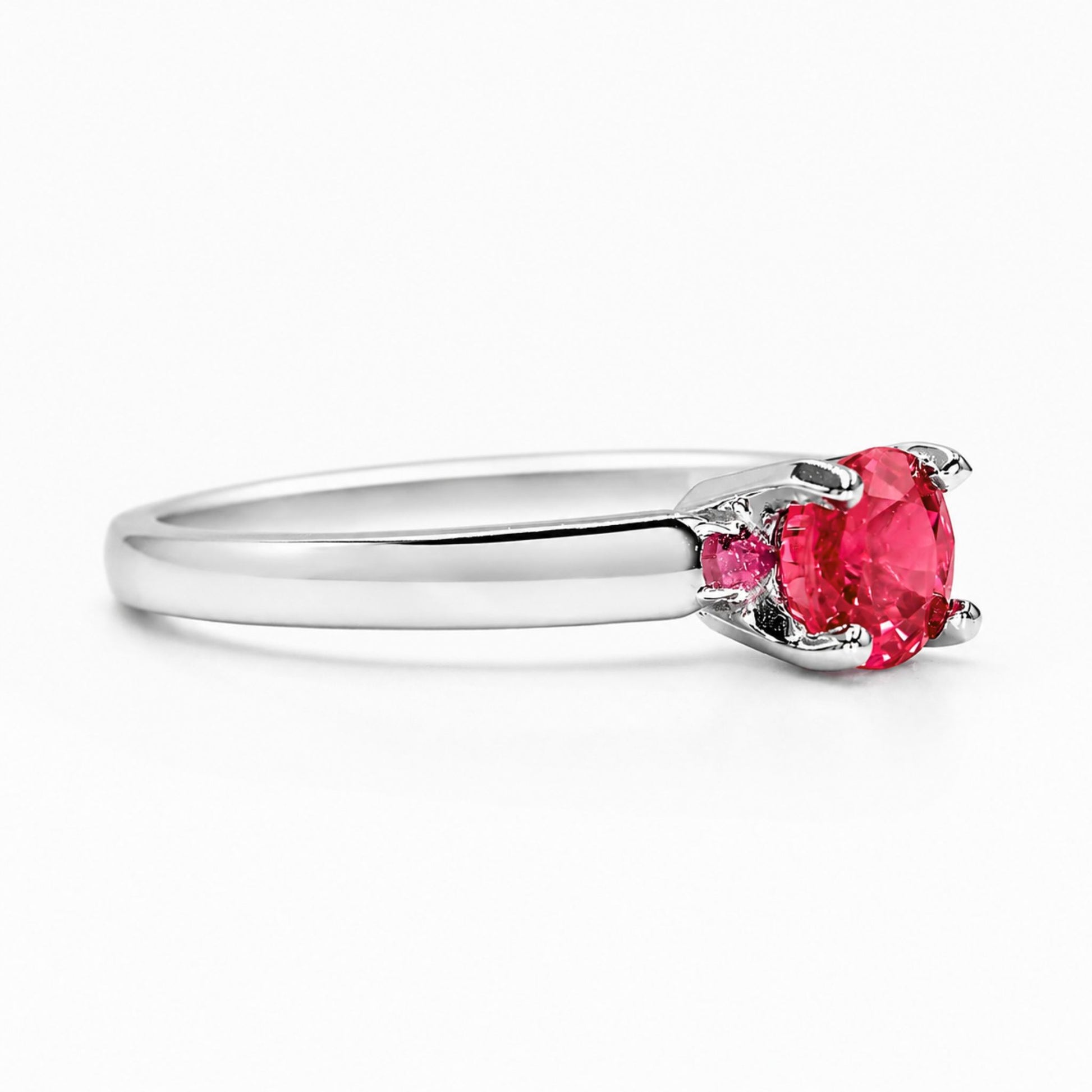 Close-up of round ruby engagement ring in 18K white gold setting
