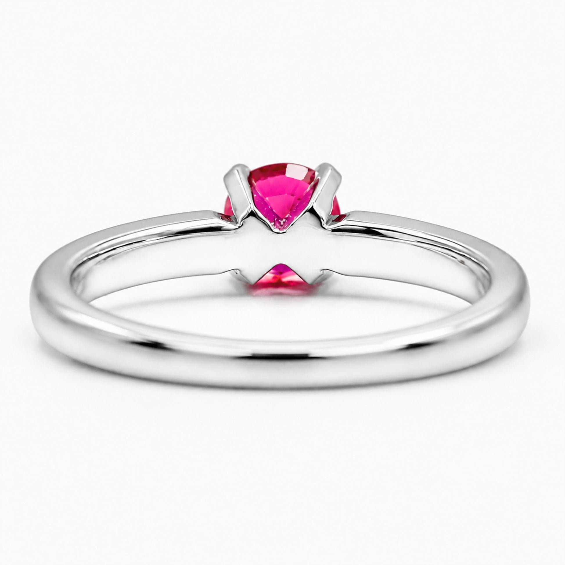 18K white gold ruby ring featuring a vivid round ruby gemstone