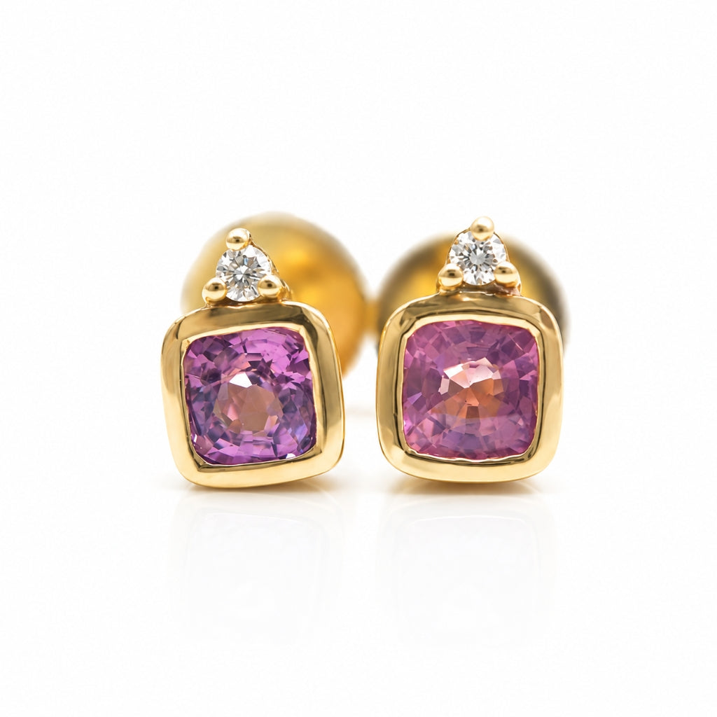 Handcrafted 14K gold pink spinel and diamond stud earrings with natural cushion-cut gemstones.