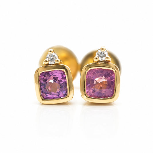 Handcrafted 14K gold pink spinel and diamond stud earrings with natural cushion-cut gemstones.